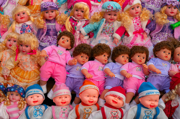 Beautiful cute baby dolls for sale at retail shop at Christmas market, New Market area, Kolkata, West Bengal, India.