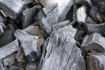 Natural Hard wood charcoal for barbecue at picnic background. Selective focus.