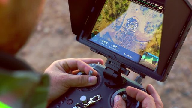 Operating a drone controller for the DJI Inspire 2, with CrystalSky 5.5 inch monitor.