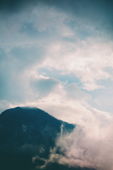 Clouds fell on the mountains during the rain.