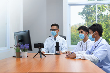 Fototapeta premium Video conferencing, concilium remote communication concept.Group of medics discuss x-ray scan.Team of doctors having meeting in clinic.