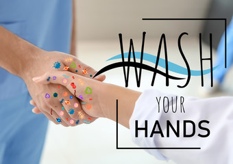Doctors shaking hands in clinic. Concept of washing hands