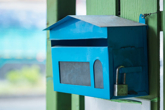 The Blue Mail Box In Front Of The House