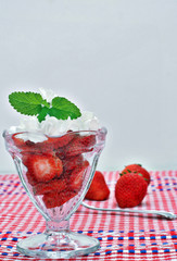 Fresh strawberries and whipped cream.