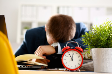 Red alarm clock shows late time closeup