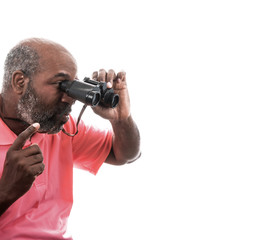 Fototapeta na wymiar African American man looking through binoculars on white background with copy space. Spy or investigation concept.