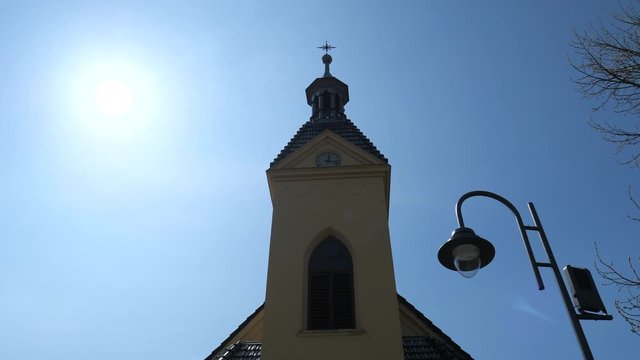 Hermanice v Podjestedi, Czech Republic, 17th of April 2020. Church of St. Anthony with Trabant sedan car, produced in East Germany.