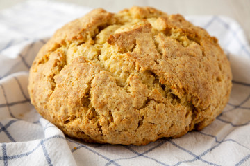 Homemade Irish Soda Bread on cloth, low angle view. Close-up.