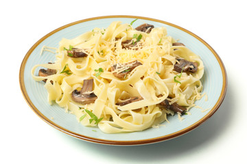 Plate with pasta, cheese and mushrooms isolated on white background