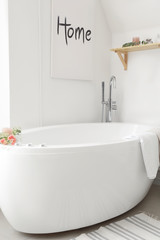 Clean bathtub in modern interior