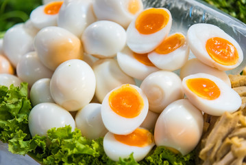 Peeled boiled eggs in both whole and half shape, healthy boiled eggs.
