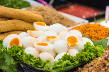 Peeled boiled eggs in both whole and half shape, healthy boiled eggs.