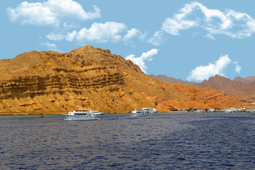 Egypt. Mountains, sandy mountains, sea with yachts, sea holidays.