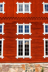 Fototapeta na wymiar Wooden facade with beautiful windows
