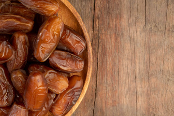Close up of cluster dates plam. Fresh dates plam on wooden table.