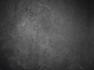 Texture of dark gray concrete wall, space for text.