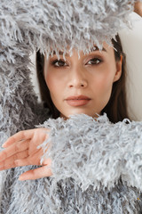 Image closeup of stylish asian woman posing and looking at camera
