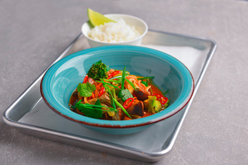 Colorful Asian meat and vegetable dish. Sweet and sour pork and mixed vegetable delicacy. Tasty dinner.