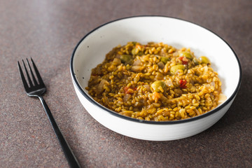 plant-based food, vegan farro with Mediterranean vegeteables and olives with Moroccan spices