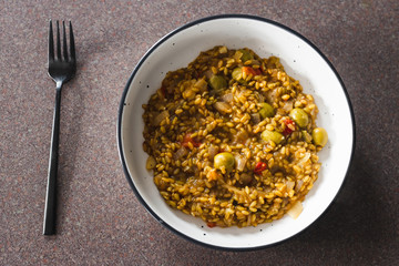 plant-based food, vegan farro with Mediterranean vegeteables and olives with Moroccan spices