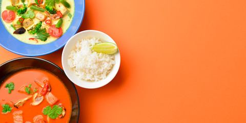 Asian food. Dish with noodles, chicken stir fry and vegetables ingredients with spices, sauces, sushi.