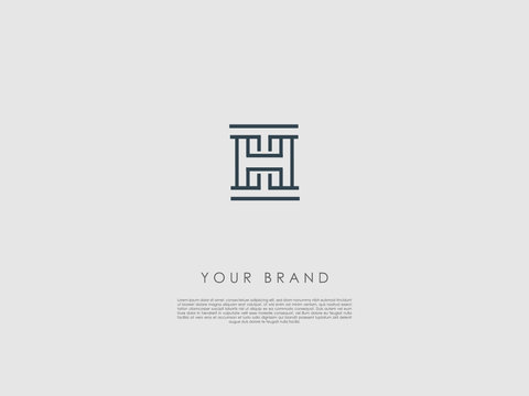 a grey rectangular minimalist business logo with initials t and h