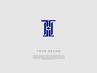 a dark blue business logo which has a diamond shape in the middle and has letters t, h and i