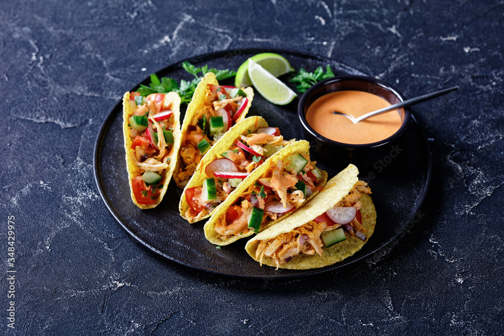 Poster corn taco shells with shredded chicken breast