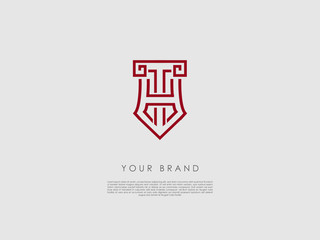 a red business logo that looks like a crest and has representations of an ancient column, tip of a pencil, letter h and t