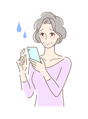 スマホを操作して不安な女性