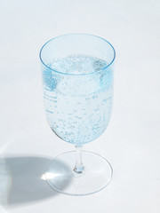 glass filled with clear mineral water
