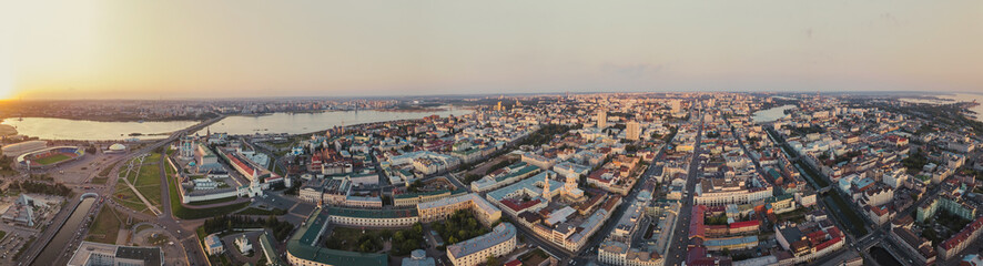 Obraz premium Beautiful panoramic picture of Kazan city center on the sunset, Tatarstan, Russia. Capital of the Republic of Tatarstan. Buildings and landmark line with sunny weather. Panorama of the sights.