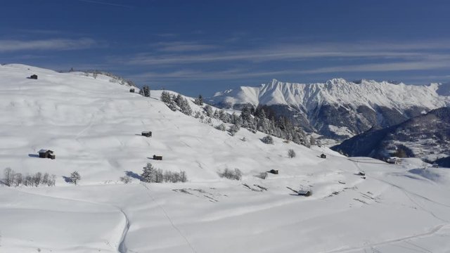 flying through the Winterwonderland Serfaus with morning sun in February