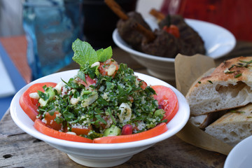 Tabbouleh salad. Traditional middle eastern or arab dish. Levantine salad parsley, bulgur, tomato.