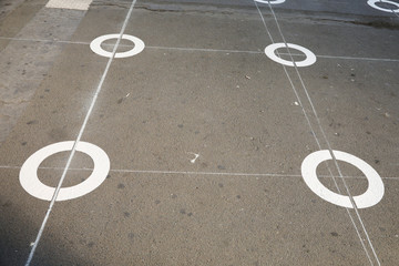 circle on cement ground floor of a walkway