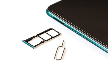 Sim card tools, Small nano sim card, and Micro SD card tray with smartphones isolated on white background. Selective focus.