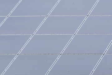 Roof with solar panel reflecting the clouds, on the roof of a farm. the Nehterlands