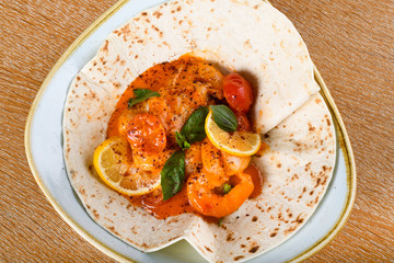 Sauteed shrimps with garlic, white wine, cherry tomatoes, fresh basil.