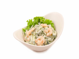 Salad of fresh cucumbers, boiled shrimps and fresh herbs seasoned with white sauce