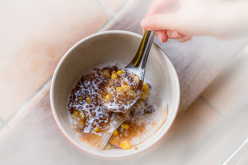A blurry abstract background of a healthy dessert menu (sago from natural trees), bring to heat and add coconut milk, corn together, moderately sweet taste
