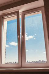 Dirty glass in a double-glazed window - spring cleaning time - the need to wash the windows