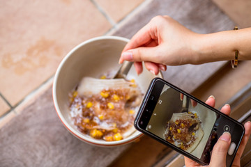 A blurry abstract background of a healthy dessert menu (sago from natural trees), bring to heat and add coconut milk, corn together, moderately sweet taste