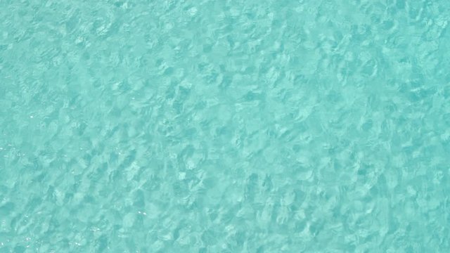 AERIAL DRON TOP DOWN STILL SHOT OF TURQUOISE TRANSPARENT MEDITERRANEAN WATER 