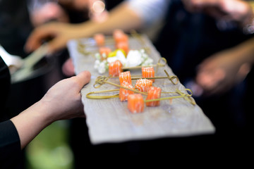 Catering with diced salmon skewers.