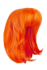 Subject shot of a lustrous spice orange wig with bangs. The shoulder-long wig is isolated on the white background. 