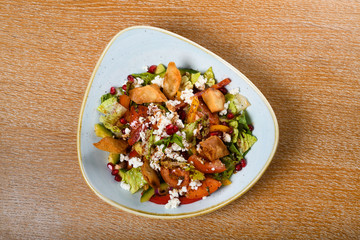 Fattoush is a Levantine salad made from toasted or fried pieces of khubz combined with mixed greens