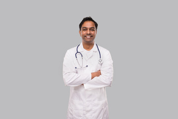 Indian Man Doctor Smiling Hands Crossed Isolated. Healthy life, Medicine Concept.