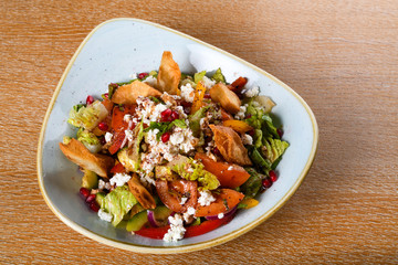 Fattoush is a Levantine salad made from toasted or fried pieces of khubz combined with mixed greens