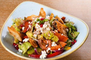 Fattoush is a Levantine salad made from toasted or fried pieces of khubz combined with mixed greens