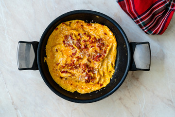 Omelette with Sweet Red Bell Capia Pepper and Parmesan Cheese in Pan Top View.